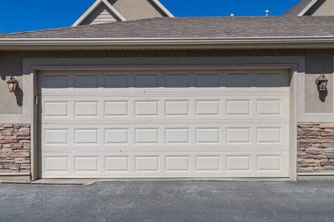 Two car garage. House can be seen behind it. - 122 S Tamarak Cir