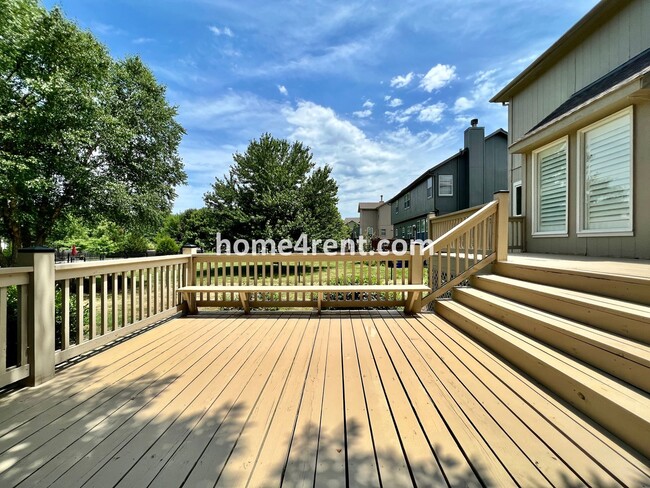 Building Photo - Updated Kitchen, Large Two Tiered Deck, Finished Basement in Blue Valley Schools!