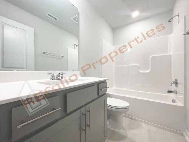 Building Photo - Brand-New 3BR/3.5BA Townhome w/ 1 Car Gara...