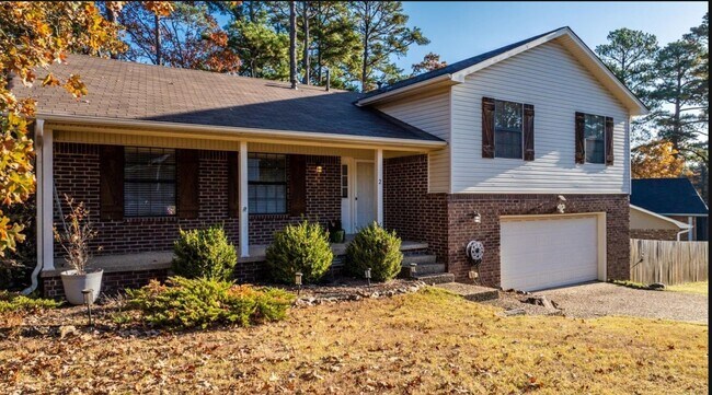 Building Photo - Welcome Home: Charming Brick Beauty with Covered Porch.