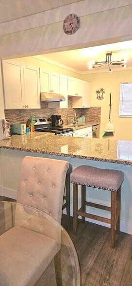 Large, it's a breakfast bar and countertop space. - 8740 Lueck Ln