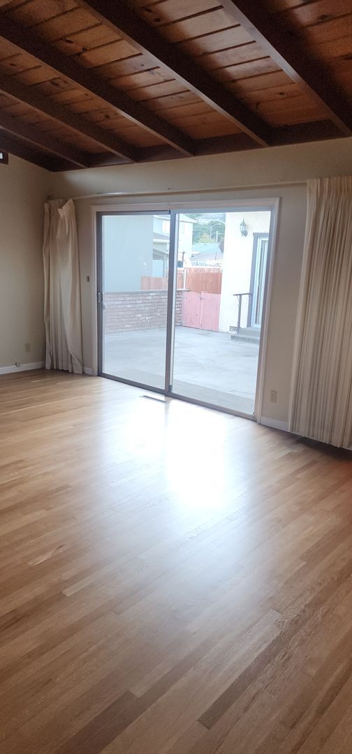 Building Photo - This is a spacious house featuring four bedrooms and two bathrooms, along with a two-car garage.