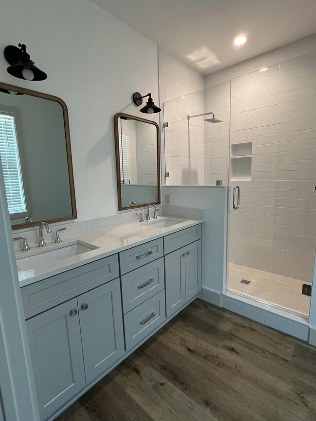 Master bath tastefully done with tile to the ceiling. - 114 Enchanted Way