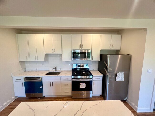 Building Photo - Brand New Renovation! 3 BR/ 2 BA On Quiet ...