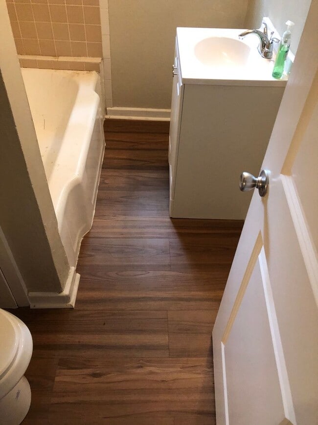 Building Photo - Freshly Painted 2x1 with Brand-New Plank F...