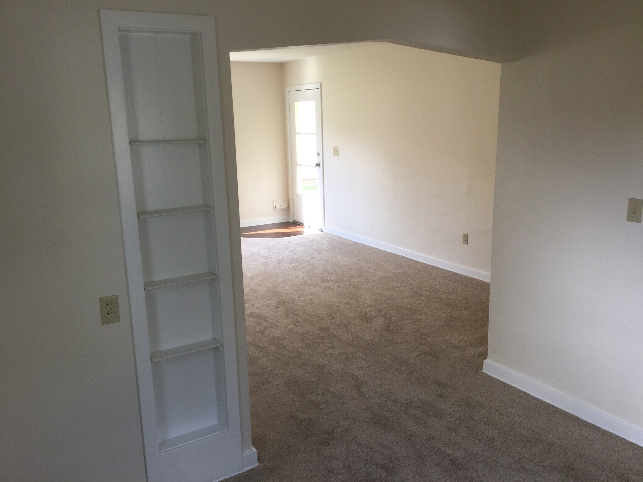 Original charming built-in display cabinet in dining room and view to front door - 1008 E 2nd St
