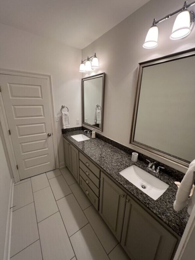 Building Photo - Luxury 4BR Home in Americana | 11 Ft Ceilings, Courtyard Living & Furnished Option