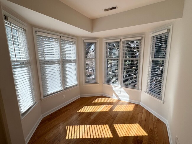 Building Photo - Top-Floor End Unit Condo at New Bern Place