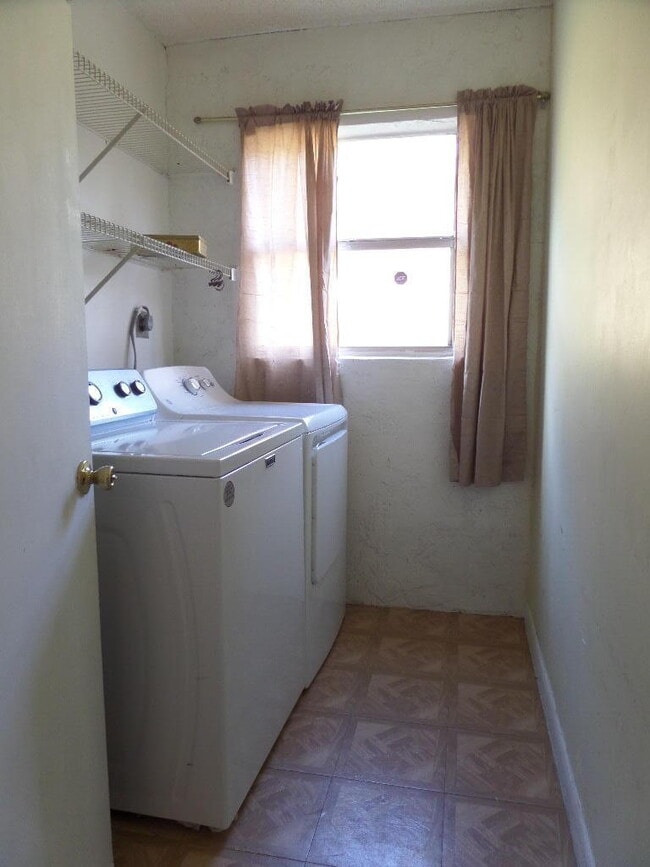 Building Photo - 8633 Pluto Terrace