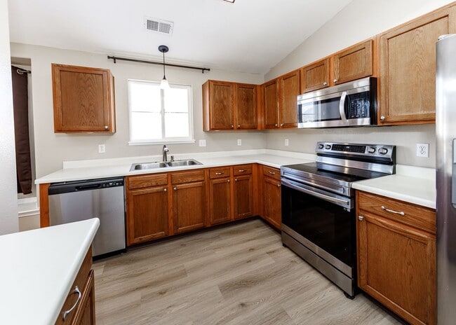 Building Photo - 3 Bed Top Floor Condo near Ft. Carson in Gated Community with detached Garage