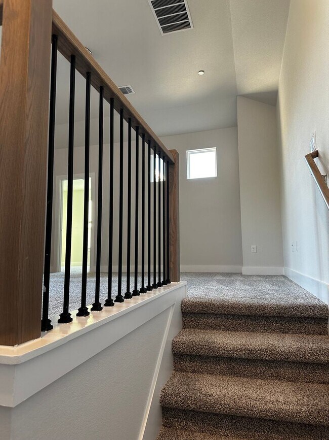 Building Photo - For Lease – Modern 2023 Condo Backing to Greenbelt | Creekside at Pioneer Crossing West