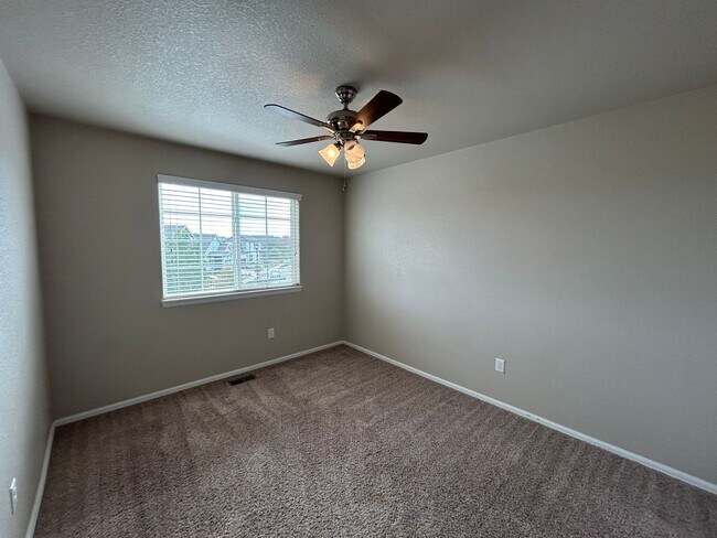 Building Photo - $500 Off First Month Of Rent! Modern 3BR Townhome with Fenced Yard & Garage