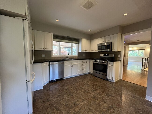 Building Photo - Beautiful 3-Bedroom Home with Remodeled Kitchen, Dual Living Spaces & Spacious Backyard