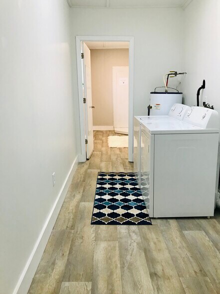 Laundry room off garage and Den. - 9225 Amos Rd