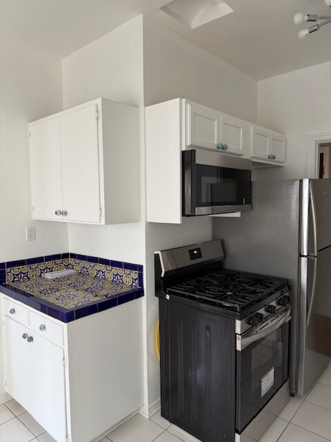 new stainless microwave and stove - 232 N Clark Dr