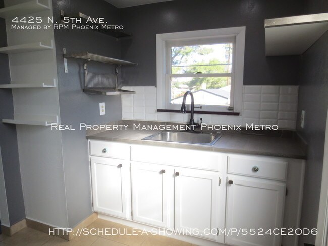 Building Photo - UPTOWN HOME WITH PRIVATE YARD!