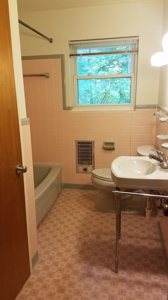 One of two vintage tiled bathrooms, new sconces and mirrored medicine cabinets. This one has large linen closet, the other a walk-in shower. - 312 Signal Mountain Blvd