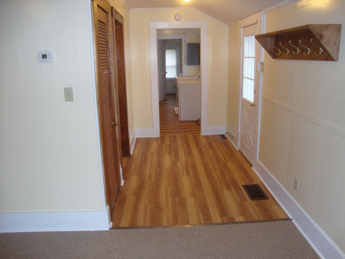 Entryway toward Laundry Area and Bathroom. - 415 Oak Dr