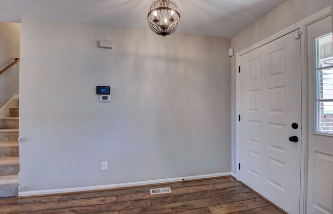 Building Photo - Welcome Home: Charming Brick Beauty with Covered Porch.
