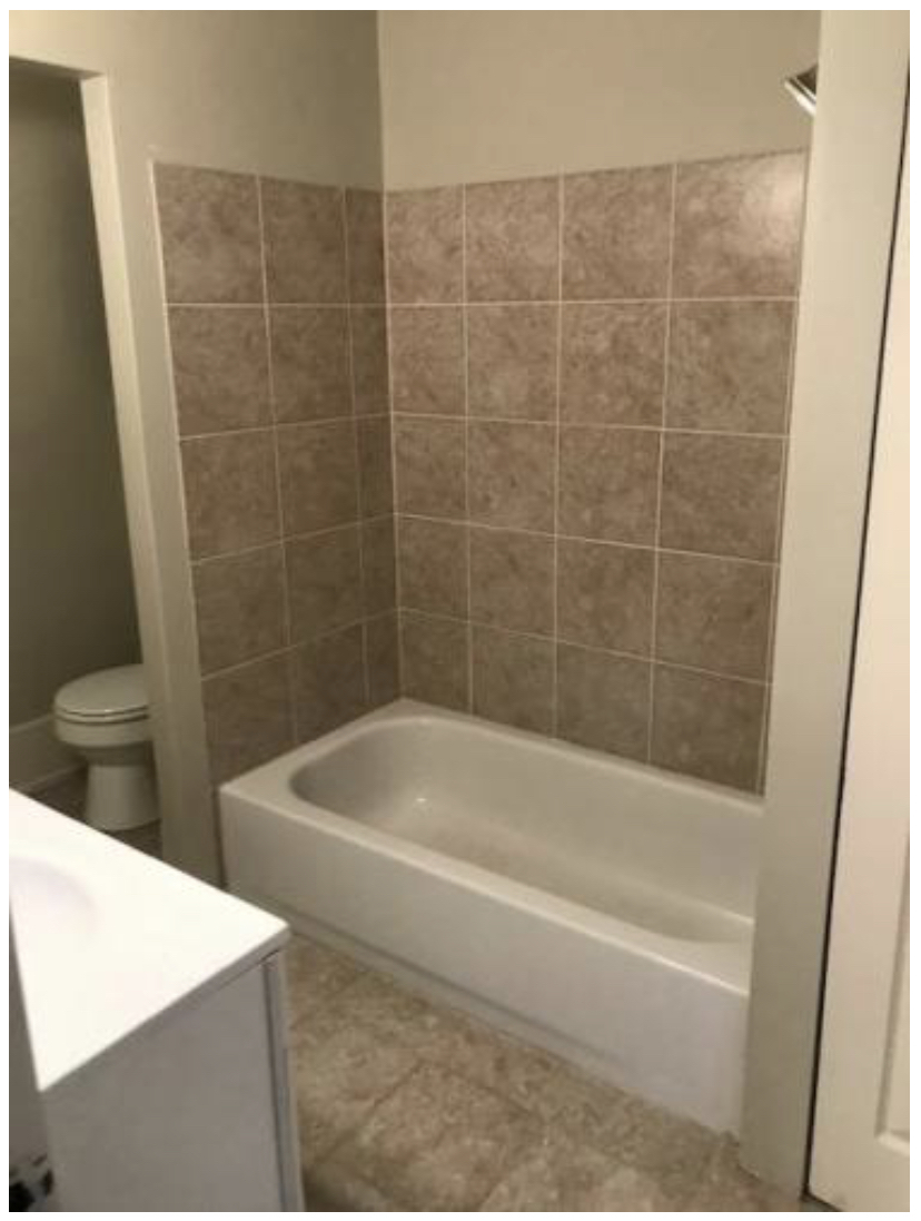 Ceramic tile flooring and tub surround - 801 S Main St