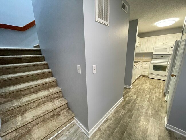 Building Photo - Updated, spacious 4br 2ba condo within wal...