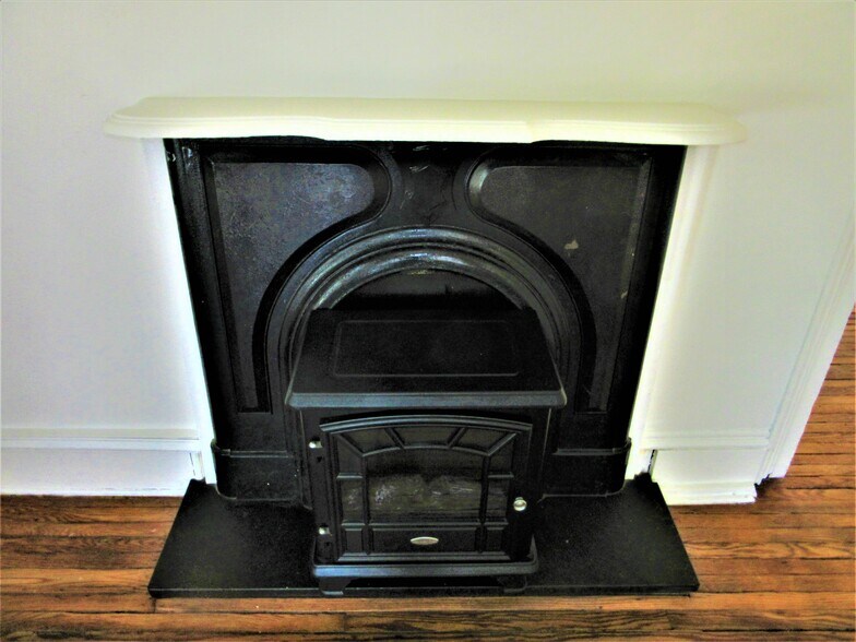 closeup of one of two cast fireplaces converted to electric - 704 N Randolph St