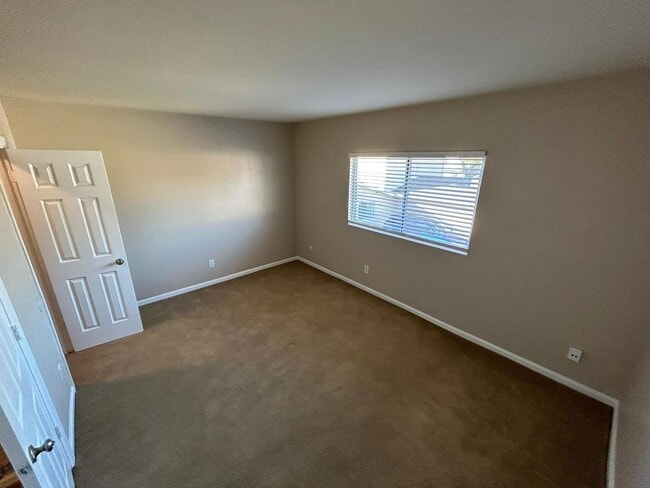 Building Photo - 2 Bedroom 1.5 Bath Townhome. Gated Community. Upgraded & 2 Parking Spaces