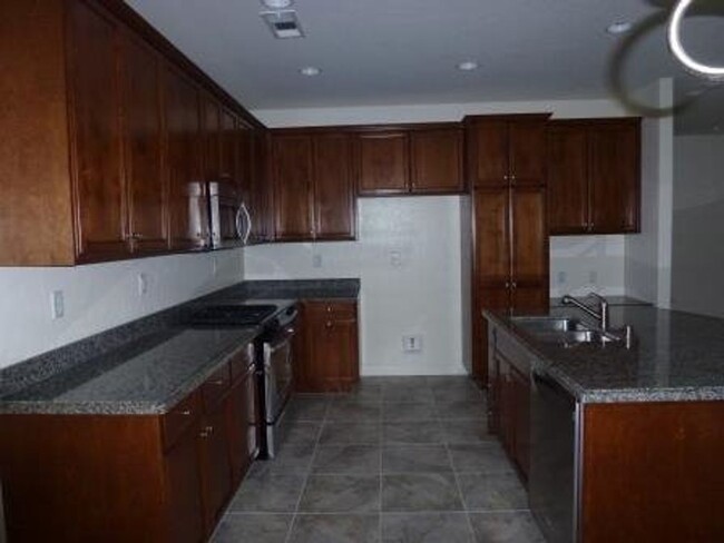 Building Photo - 4 Bedroom home in gated community + most u...