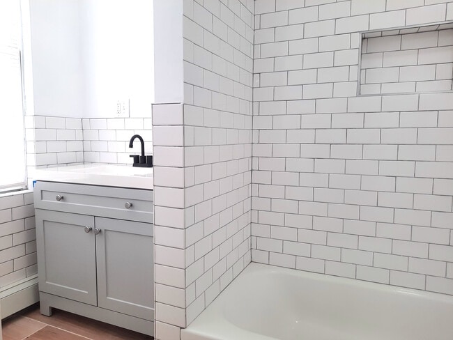 Renovated bathroom with tub - 1205 Bergenline Ave