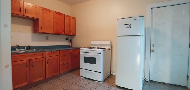 Gas stove and apartment size refrigerator - 58 Paine St