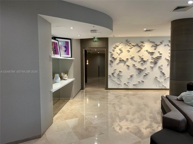Building Photo - 10275 Collins Ave