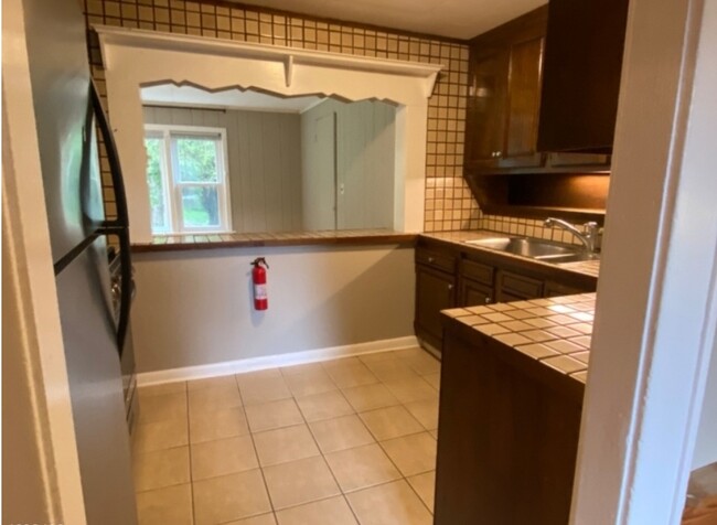 Kitchen with pass through to living room - 95 Logan Ln