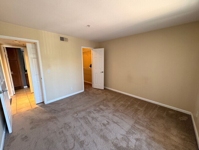 Building Photo - 1BR Condo with Private Balcony, Central A/C & Community Amenities in Corona