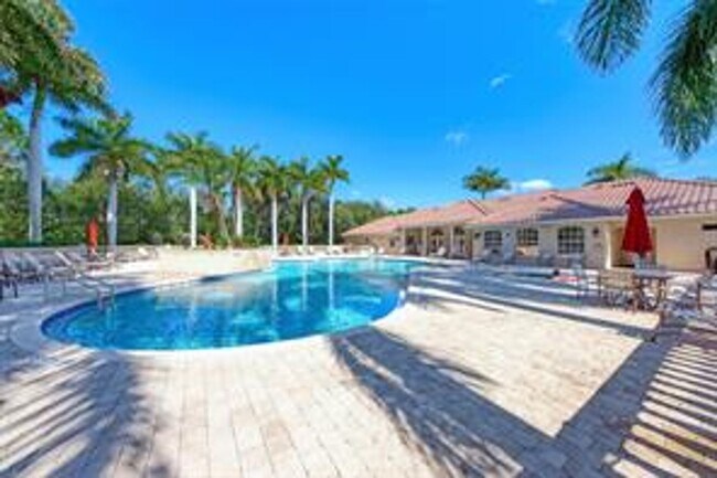 Building Photo - Elegant 3 Bedroom End-Unit Condo with Screened Lanai & Pond Views and A Private Garage