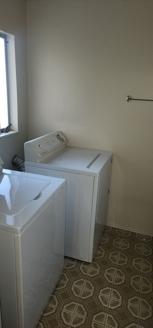 Building Photo - This is a spacious house featuring four bedrooms and two bathrooms, along with a two-car garage.