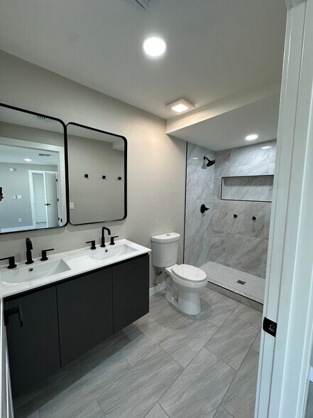 Master bathroom with double floating vanity and walk-in shower - 1331 W Speedway Blvd