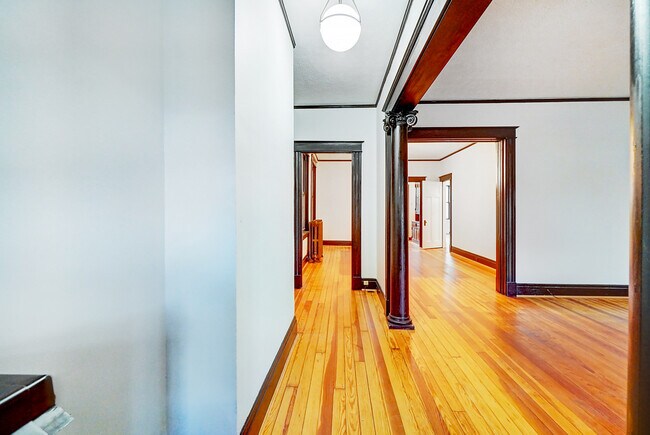 Unit 1 front hallway into dining and living rooms - 312 E 3rd St
