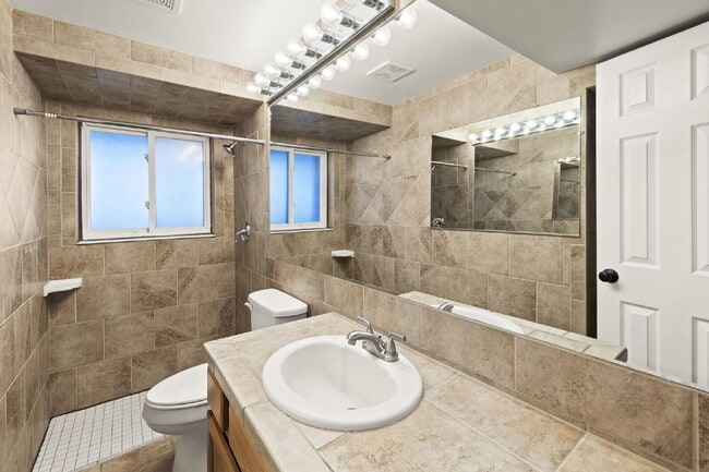 Building Photo - Spacious Split-Level Home with Beautiful Kitchen, Large Deck, and Fully Fenced Yard