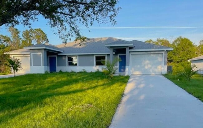 Building Photo - 3/2/1 - GREAT LOCATION IN LEHIGH ACRES- BELL BLVD