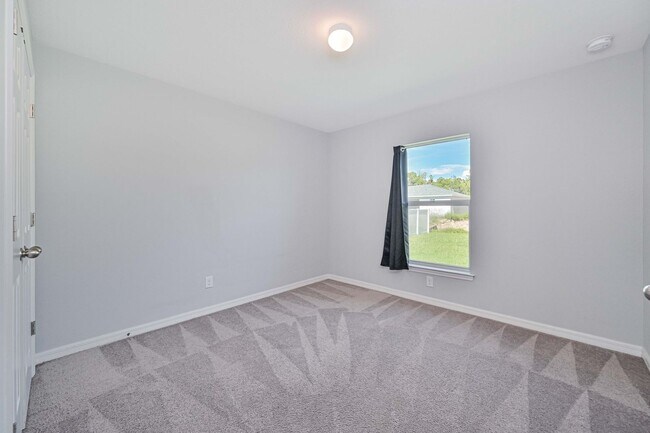 Building Photo - Spacious Three-Bedroom Home with Open Floor Plan, Large Yard