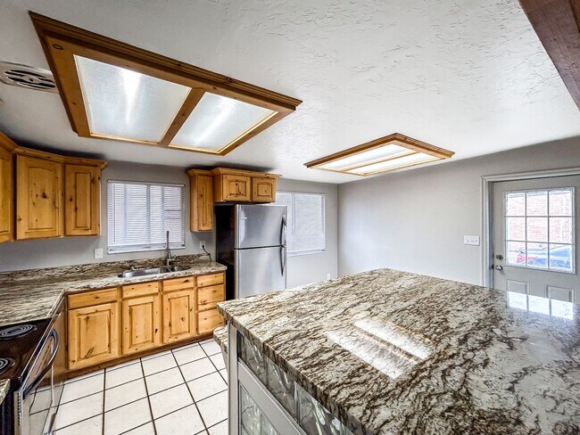 Building Photo - Spacious 5-Bedroom Home with Lofted Garage