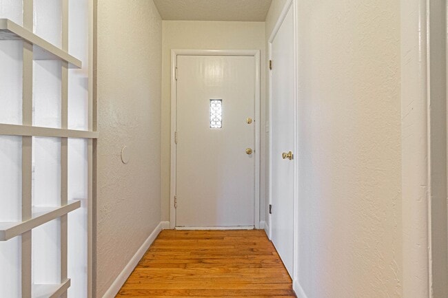 Building Photo - Three Bedroom Home in tree filled neighborhood! Lawn care included!