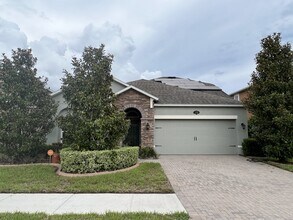 Building Photo - "Spacious 4-Bedroom Lutz Home with Elegant...