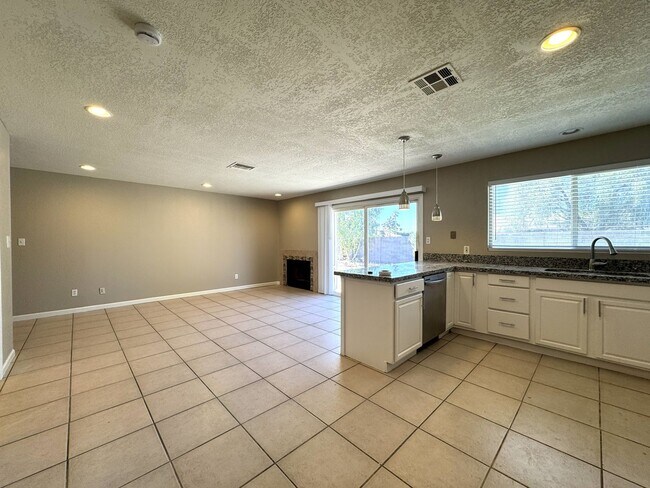 Building Photo - CORNER LOT 3 BEDROOM PLUS DEN WITH FIREPLACE AND LARGE YARD