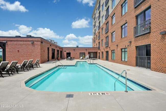 Building Photo - Welcome to your dream condo in the heart o...