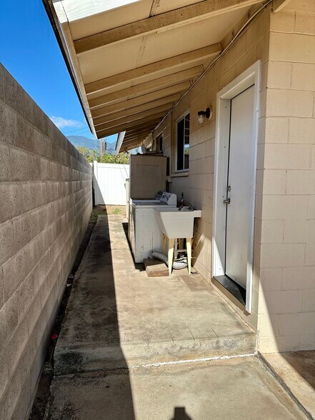 Laundry units & outside storage, back door - 200 Lono Ave
