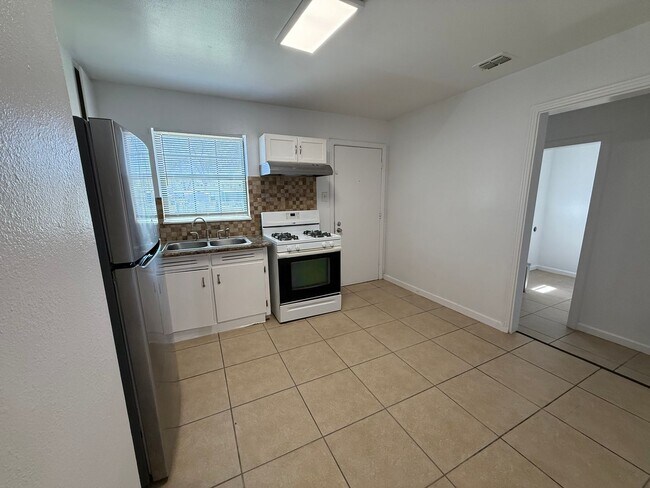 Building Photo - Charming 3BR Home w/ Hardwood Floors & Private Yard – Great SA Location