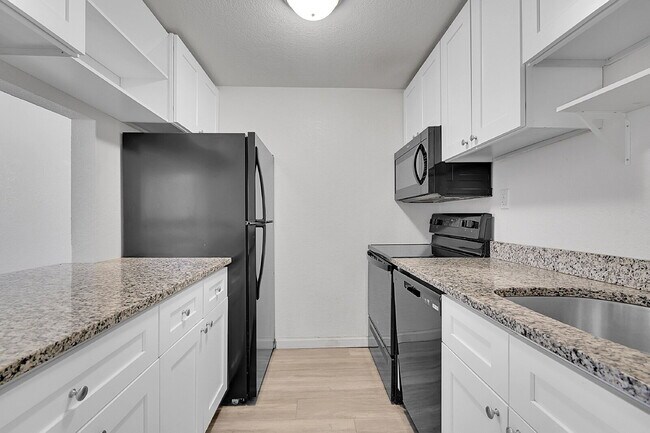 Building Photo - $1,470.95  - 2 Bedrooms, 1 Bathroom, Condo in Denver with Cozy Carpet!