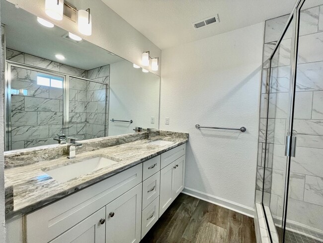 Building Photo - Practically New & Available NOW! Americana Luxury Townhomes! Pet Friendly! Attached Garage! All A...