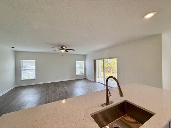 Building Photo - GORGEOUS, Large Completely Renovated Two-Story 4/2.5 PLUS LOFT in POINCIANA VILLAGES!
